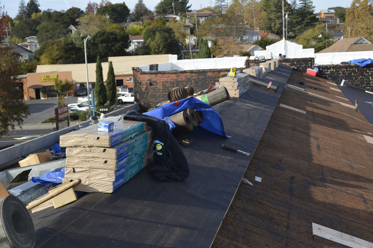 Flat commercial roof tear-off in progress