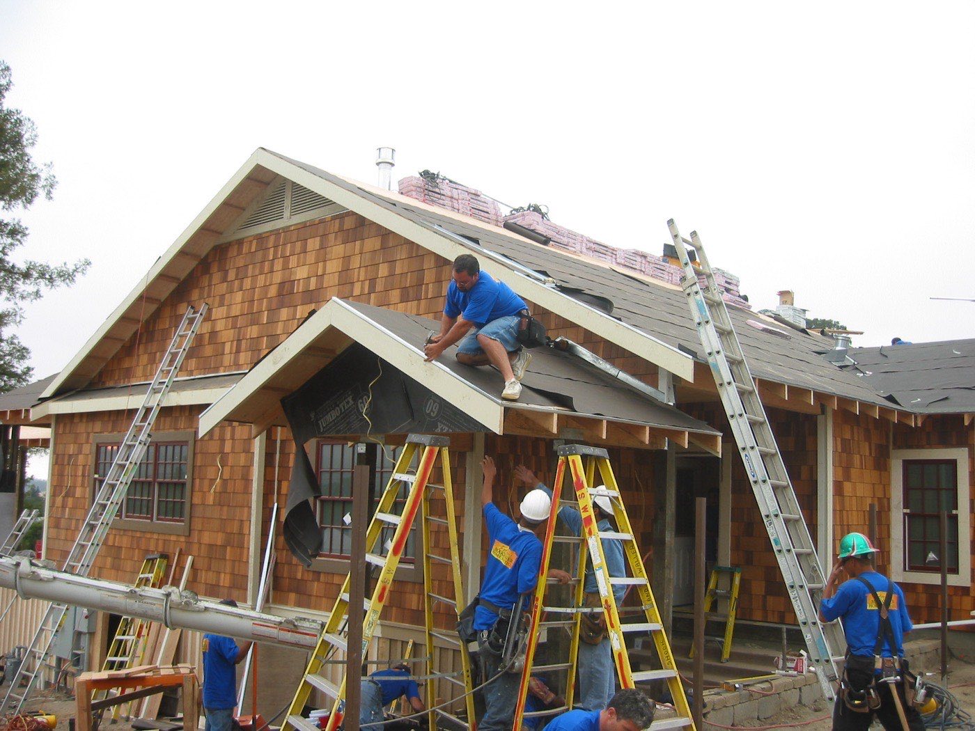 Second Generation Roofing crew installing a shake roof