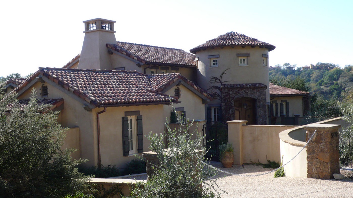 Estate entrance with tile roofing